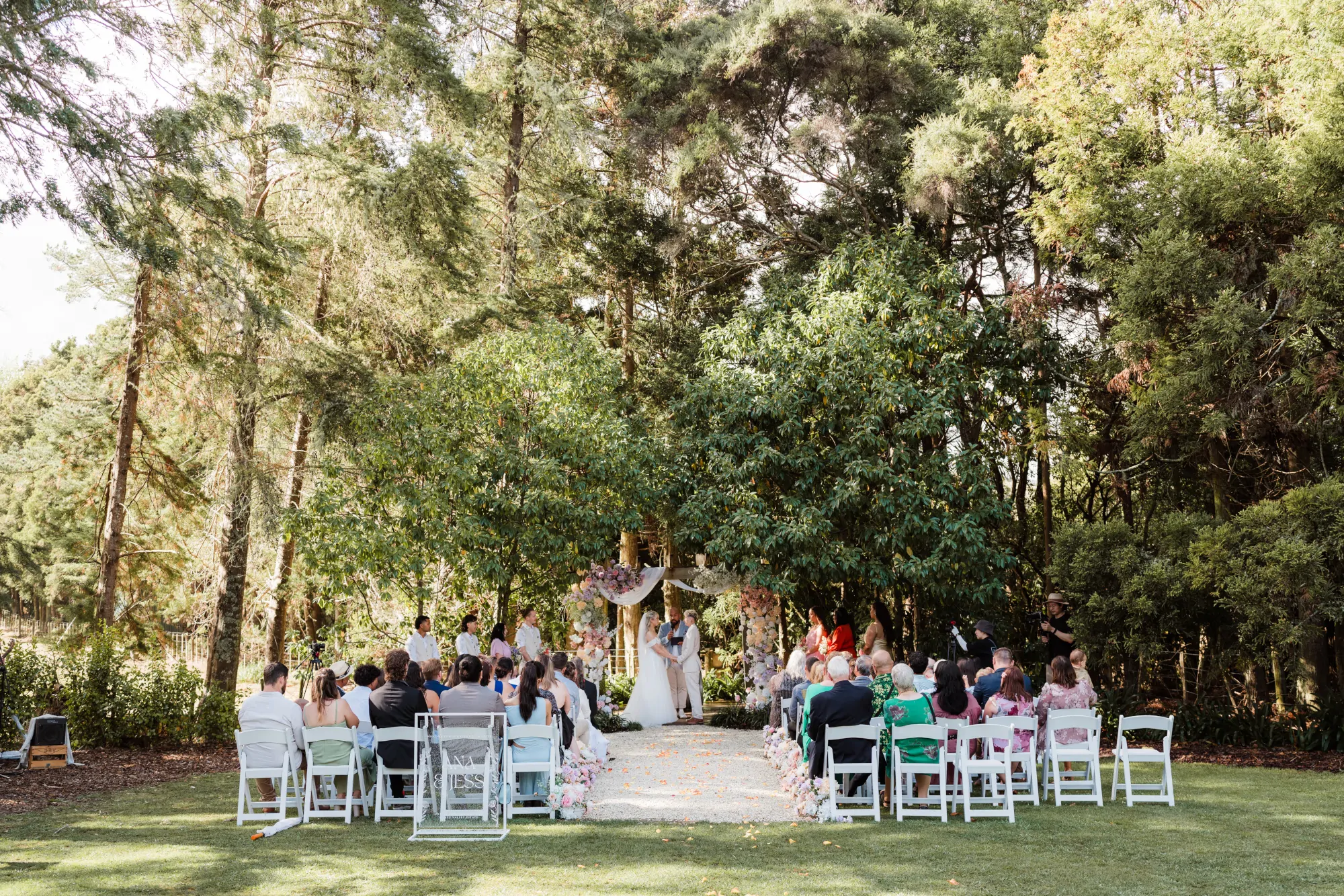 Nate Dunn officiating a wedding ceremony at Kumeu Valley Estate in Kumeu